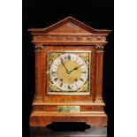 A late 19th Century walnut cased German mantle clock of architectural form with eight day striking