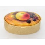 A contemporary oval pill box inset with a hand painted oval tablet depicting an apple and