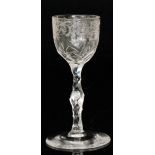 A 19th Century drinking glass in the 18th Century taste with an ovoid bowl with engraved upper rim