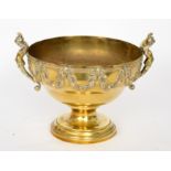 A 20th Century brass circular fruit bowl in the classical form mounted with winged females and