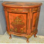 A mid 20th Century lacquered demi lune cocktail cabinet in the chinoiserie taste,