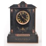 A late Victorian eight day strike black slate mantle clock,