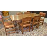 A 20th Century oak refectory dining table together with a set of six leather studded standard