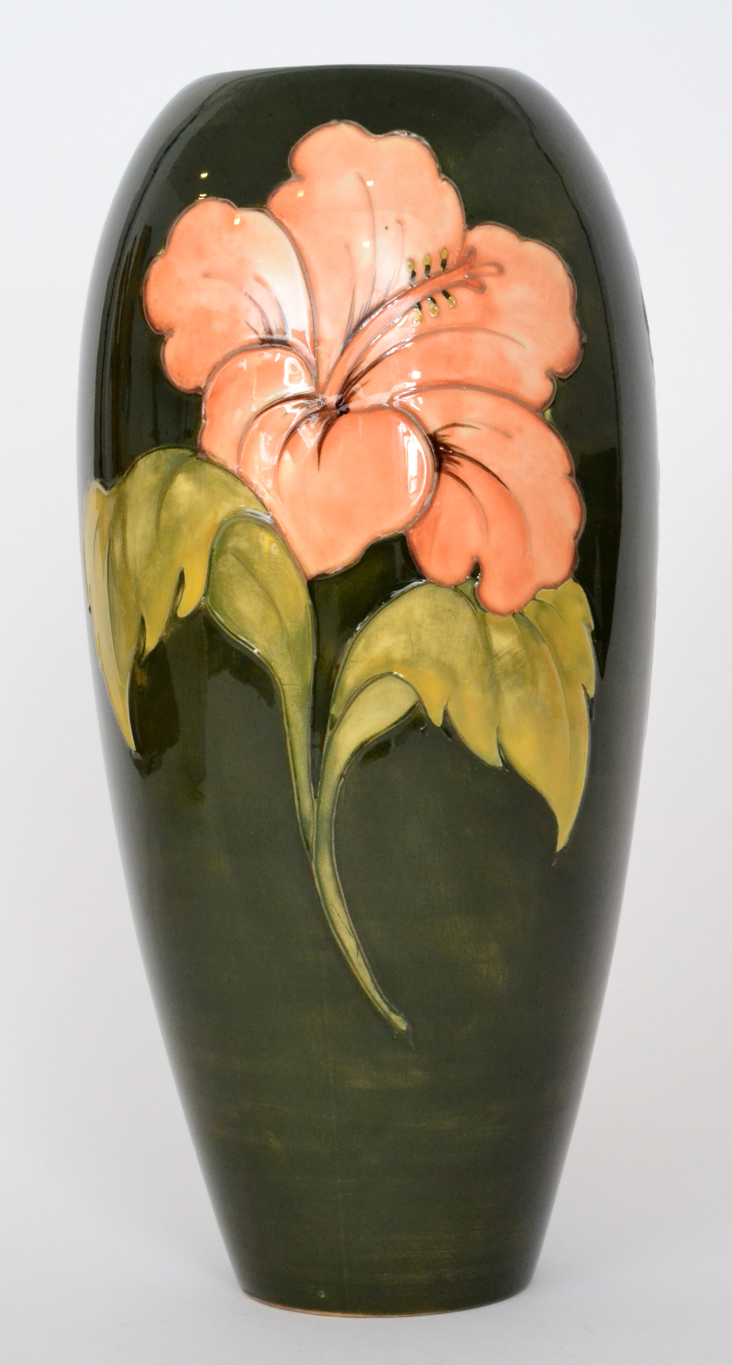 A large Moorcroft Hibiscus pattern vase of tapering form decorated with coral flower heads against