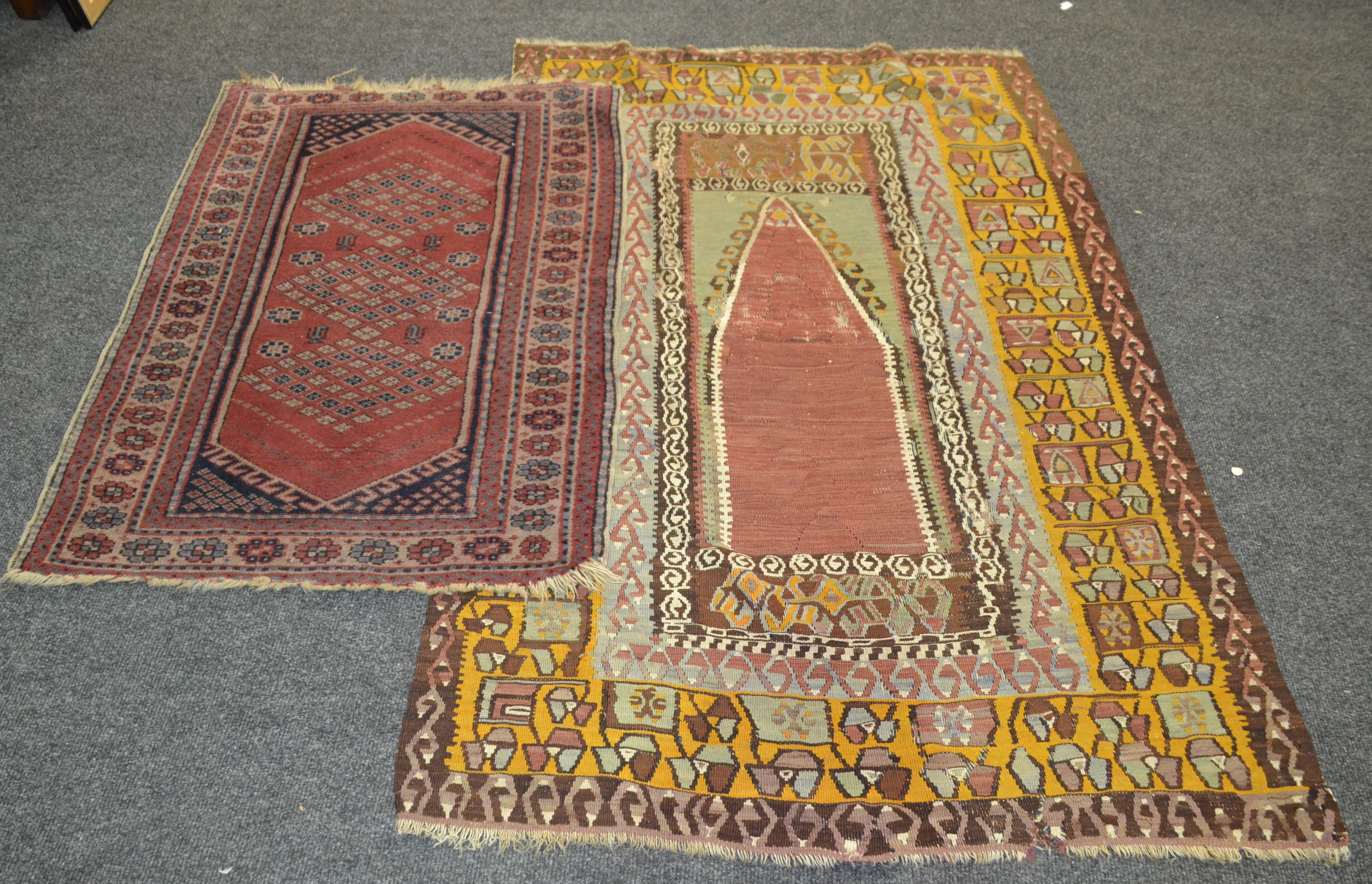 A Soumak flat weave rug the central medallion bordered by hooked botehs to a yellow border,