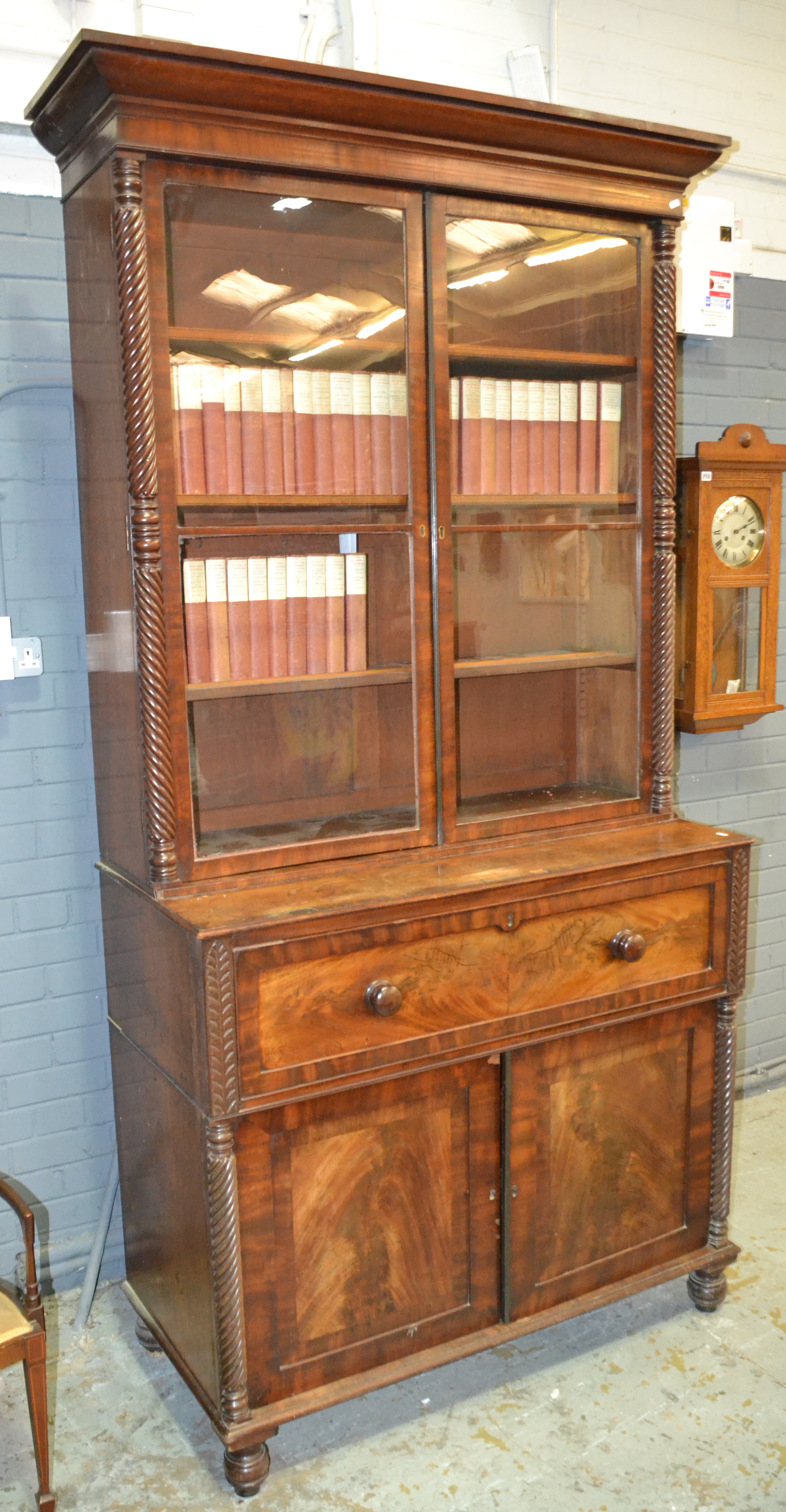 A 19th Century mahogany secretaire bookcase with wrythen-turned pilaster columns,