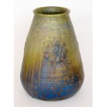 A large Ruskin Pottery barrel vase of conical form decorated in a streaked green,