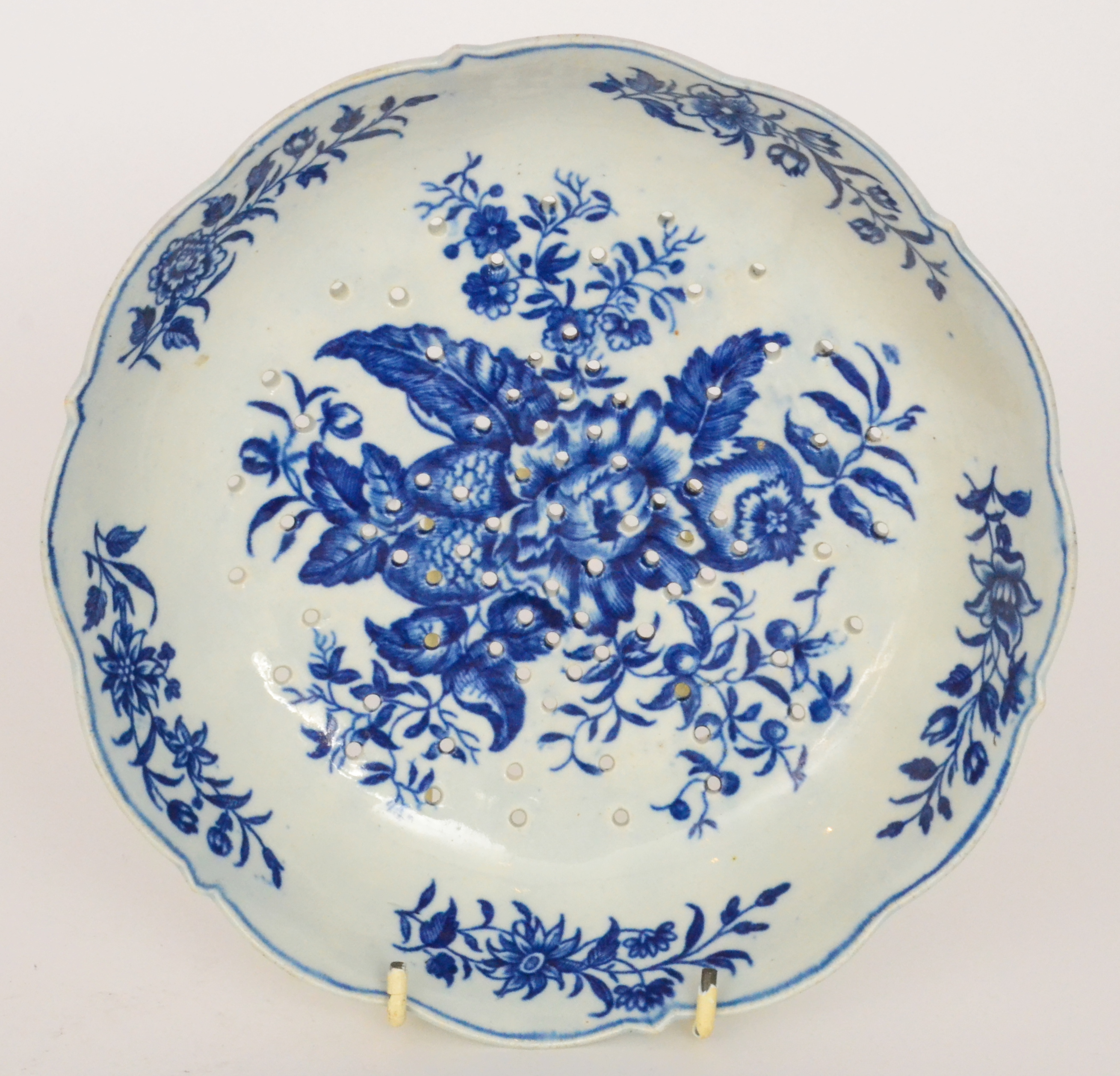 A late 18th Century First Period Worcester cress drainer decorated in the underglaze blue and white