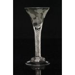 An 18th Century Jacobite wine glass circa 1745 having a trumpet form bowl engraved with a rose and