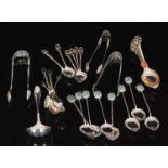 A set of eight Hong Kong silver teaspoons with carved jade style hard stone finials,