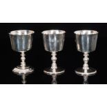 Three Elizabeth II hallmarked silver wine goblets,