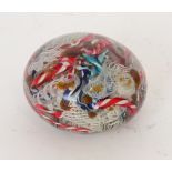 A 19th Century Italian scramble glass paperweight by Franchini Bigaglia internally decorated with