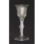 An 18th Century wine glass circa 1760 with a lipped ogee form bowl above a single series opaque