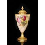 A Royal Worcester twin handled pedestal vase and cover decorated by Kitty Blake with hand painted