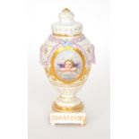 A late 19th to early 20th Century Berlin pedestal vase and cover,