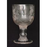 A large 19th Century oversized goblet in the 18th Century taste with an ovoid bowl engraved with a