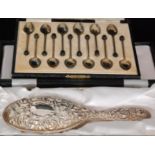 A George V hallmarked silver set of twelve coffee spoons,