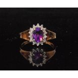 A 9ct amethyst and diamond cluster ring,