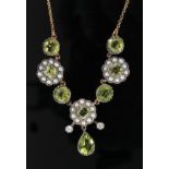 An Edwardian style silver gilt, peridot, seed pearl and diamond necklet,