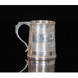 A Victorian hallmarked silver christening mug of tapering cylindrical form with reeded decoration