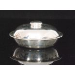 An Edwardian hallmarked silver muffin dish and cover, of plain circular form, diameter 17.