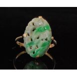 An early 20th Century 9ct oval single stone jade ring,