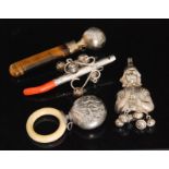 Four silver and white metal baby's teethers to include an Art Nouveau example with ivory ring,