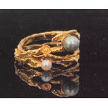 A 1970s 18ct and freshwater pearl flexible ring of abstract intertwined bark design,