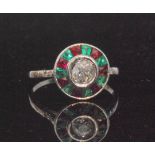 An 18ct white gold, diamond, emerald and ruby target cluster ring,