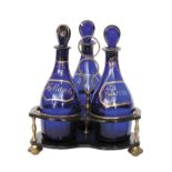 An 18th Century papier mache three bottle decanter stand of triform with brass feet,