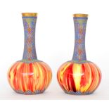 A pair of late 19th Century Loetz Carneol Ware vases of globe and shaft form decorated in the