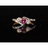 An 18ct hallmarked ruby and diamond three stone ring,