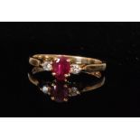 A 9ct ruby and diamond three stone ring,