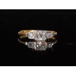 A mid 20th Century diamond three stone ring,