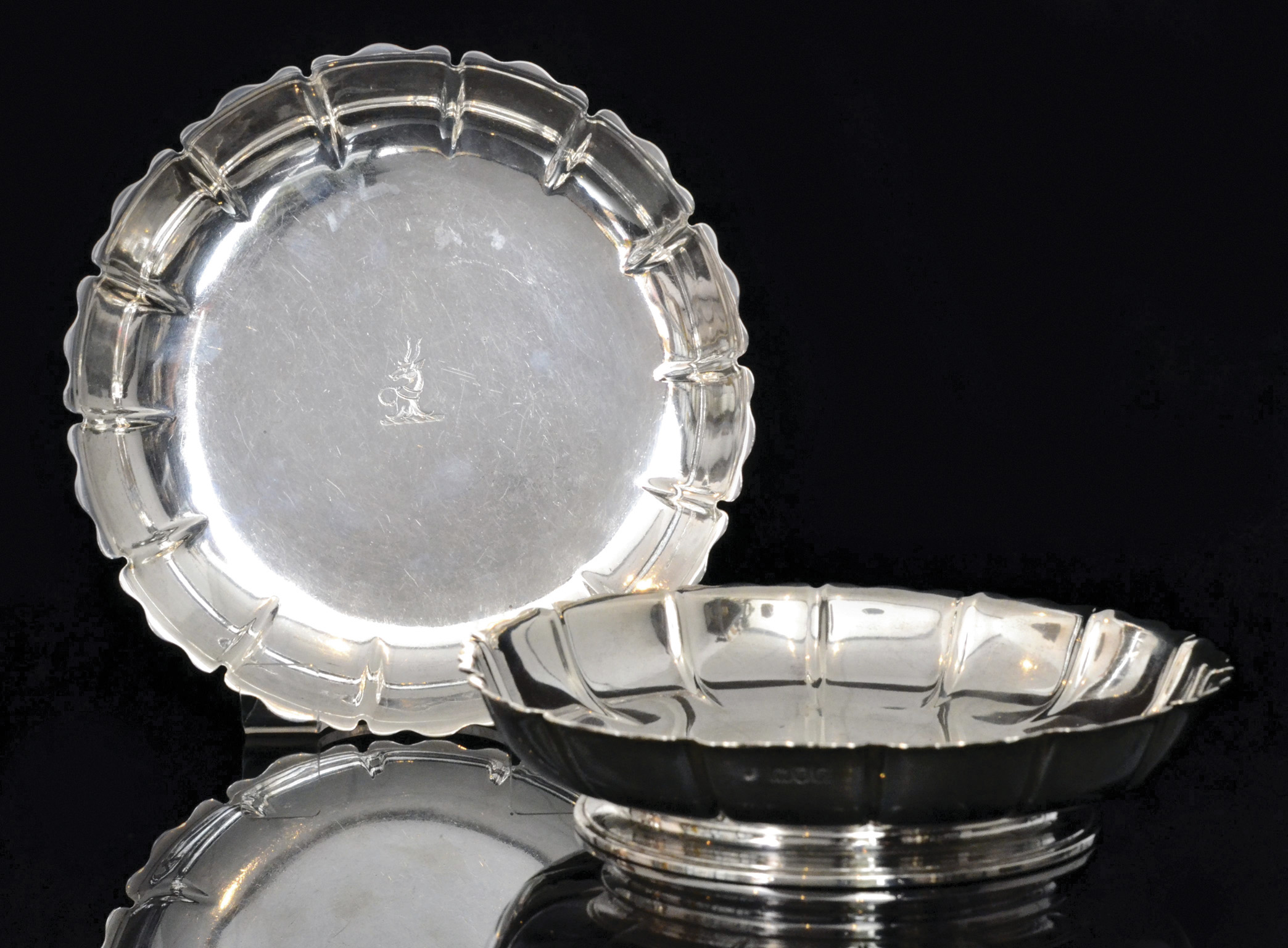 A pair of early 20th Century hallmarked silver shallow circular dishes,