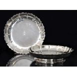 A pair of early 20th Century hallmarked silver shallow circular dishes,