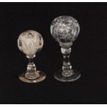 An early 19th Century paperweight wig stand with a spherical ball weight having internal coloured