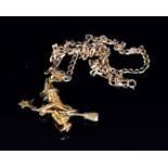 A 9ct stone set witch pendant modelled as a witch flying on a broomstick,