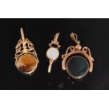 A modern 9ct rose gold swivel fob set with bloodstone and carnelian to foliate engraved mount,