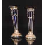 A pair of Edwardian hallmarked silver trumpet vases,