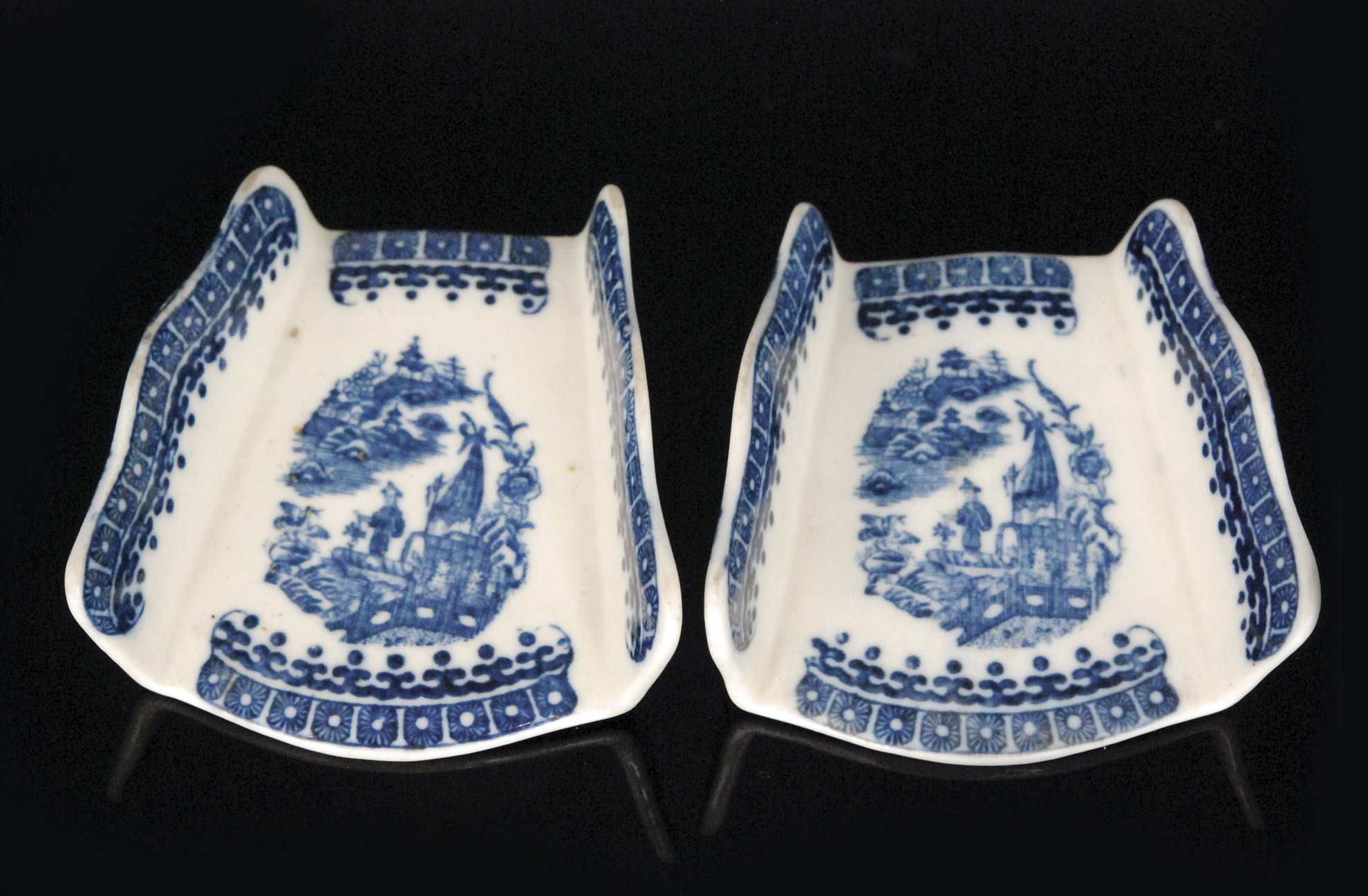 A pair of late 18th Century Caughley asparagus servers decorated in the underglaze blue and white