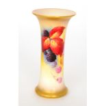 A Royal Worcester Graingers shape 323 trumpet vase decorated by Kitty Blake with autumnal fruit and