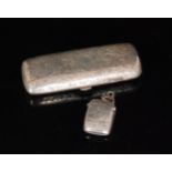 An Edwardian silver cigar case of rounded rectangular form with all over foliate engraved