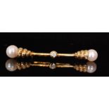 An 18ct diamond and pearl bar brooch centred by a single collar set brilliant cut diamond and