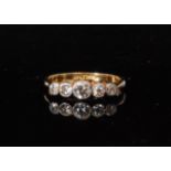 An early 20th Century 18ct graduated diamond five stone ring,