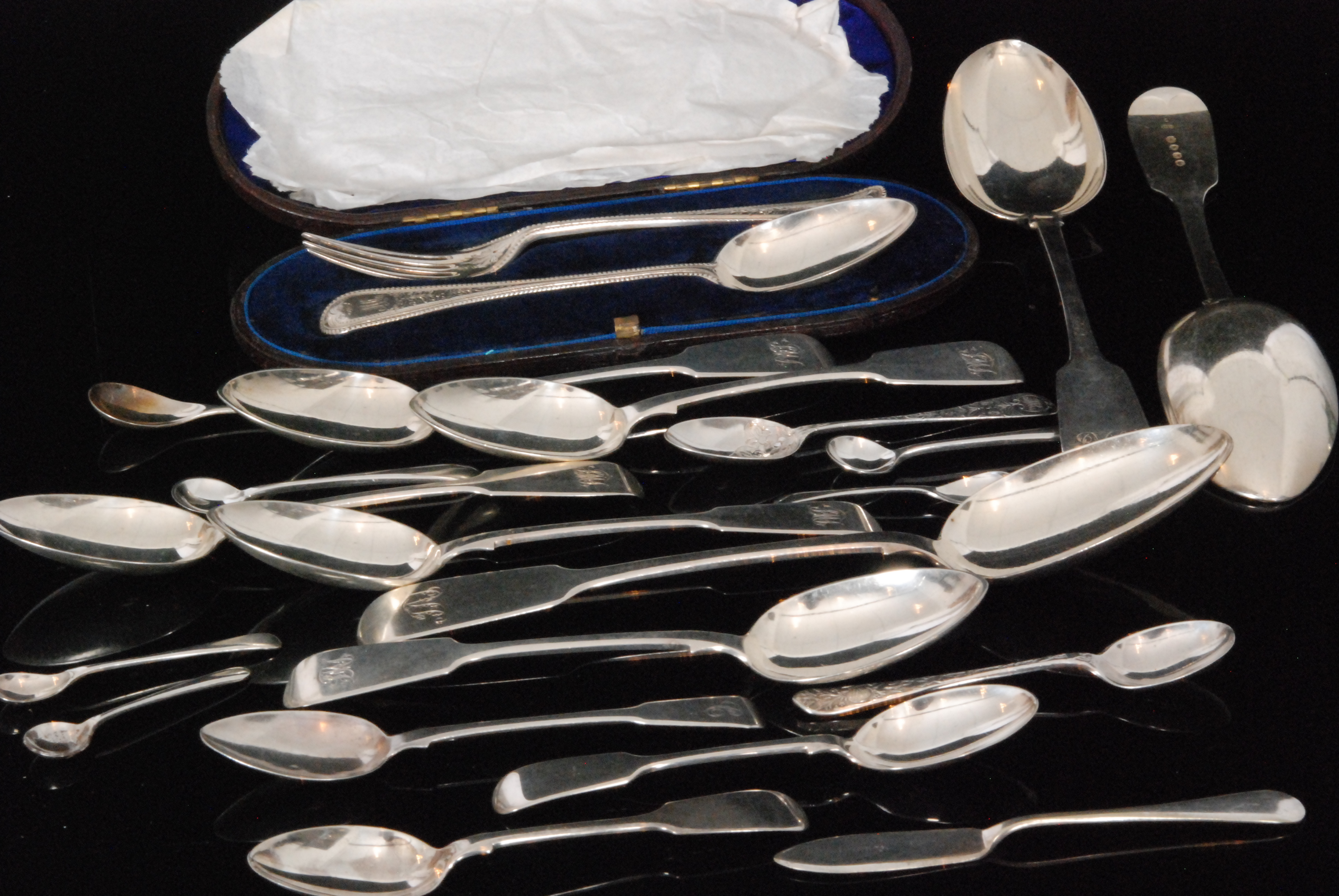 A quantity of Victorian and later hallmarked silver flatware to include two fiddle pattern