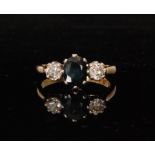 An 18ct sapphire and diamond three stone ring,