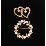 A 14ct and pearl laurel wreath brooch together with a 14ct pearl love heart brooch,