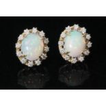 A pair of 18ct opal and diamond cluster stud earrings,
