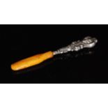 An Edwardian silver and amber teething stick,